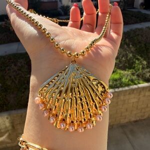 Shell Pendant Necklace with Pink Pearl Accents